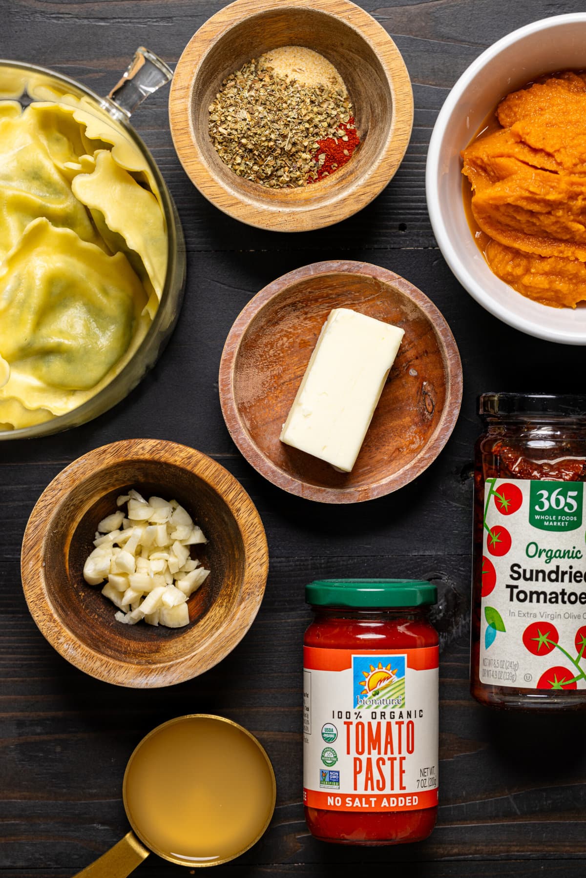 Ingredients on a black wood table. 