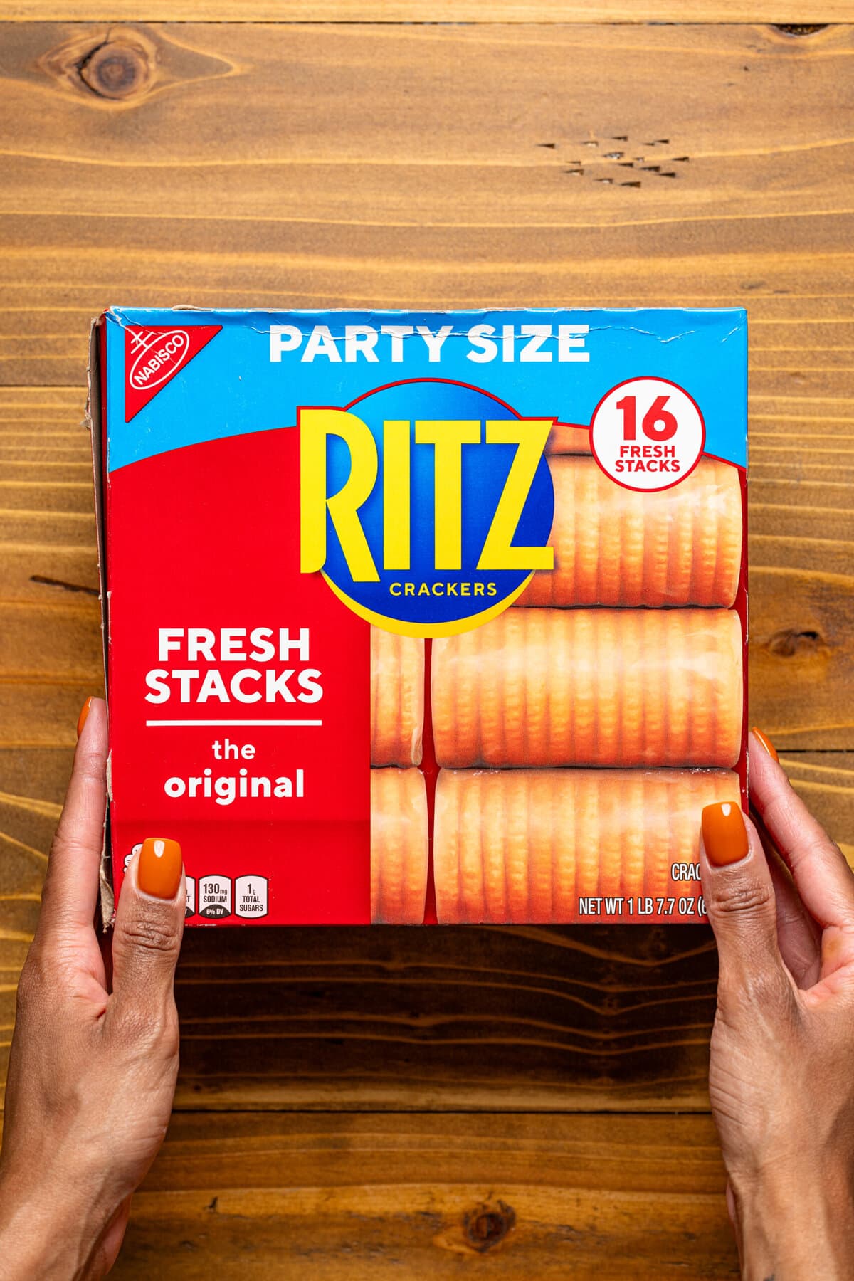 Box of ritz crackers on a brown wood table.