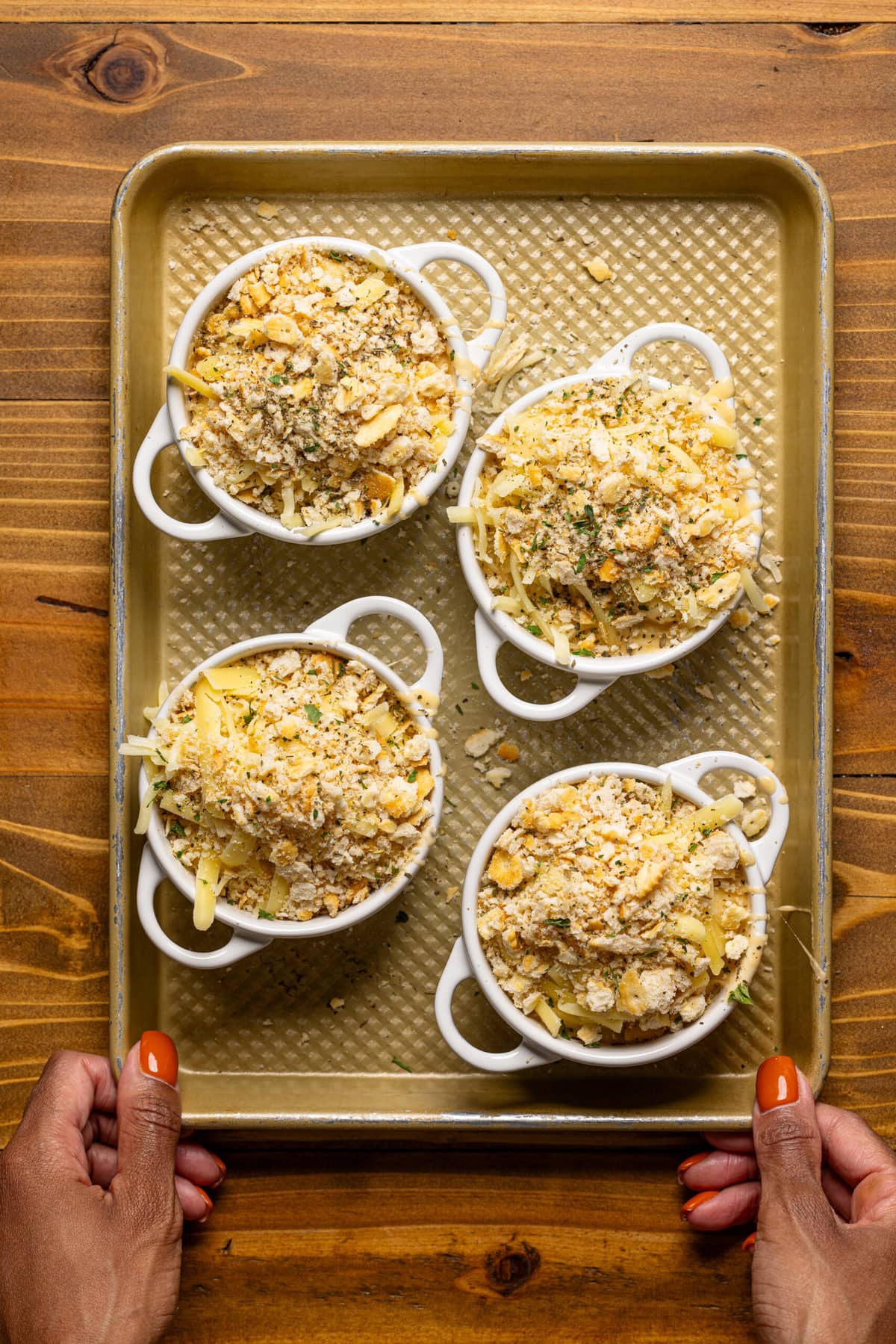 All ingredients assembled in mini cocottes on a baking sheet.