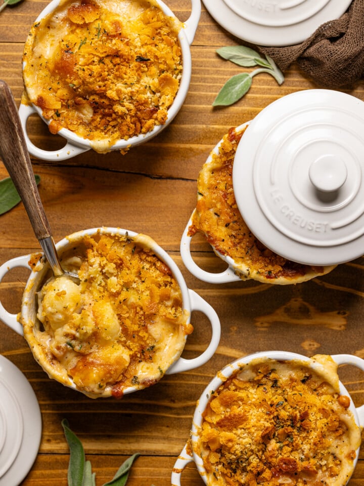 Baked gnocchi in mini cocottes with a spoon.