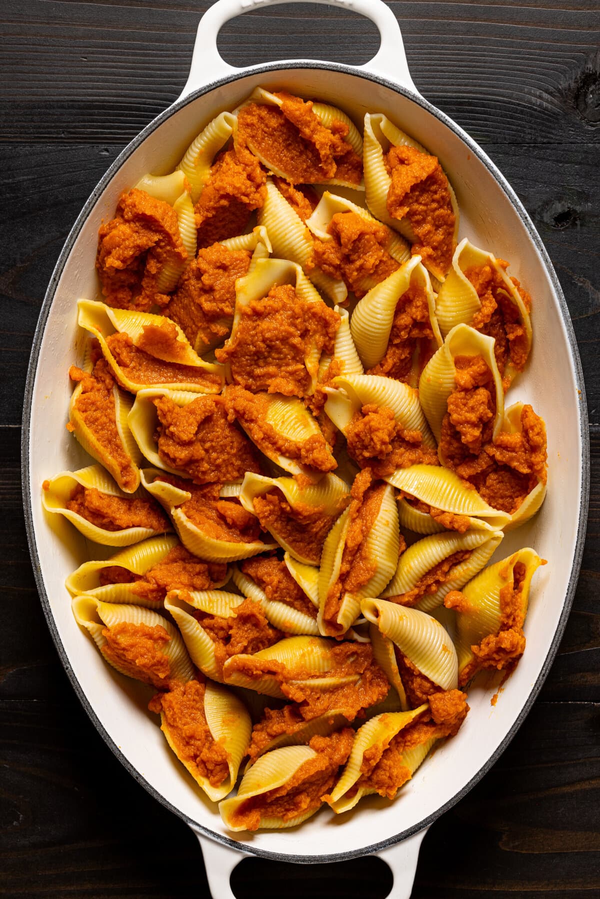 Shells in a baking dish stuffed with pumpkin. 