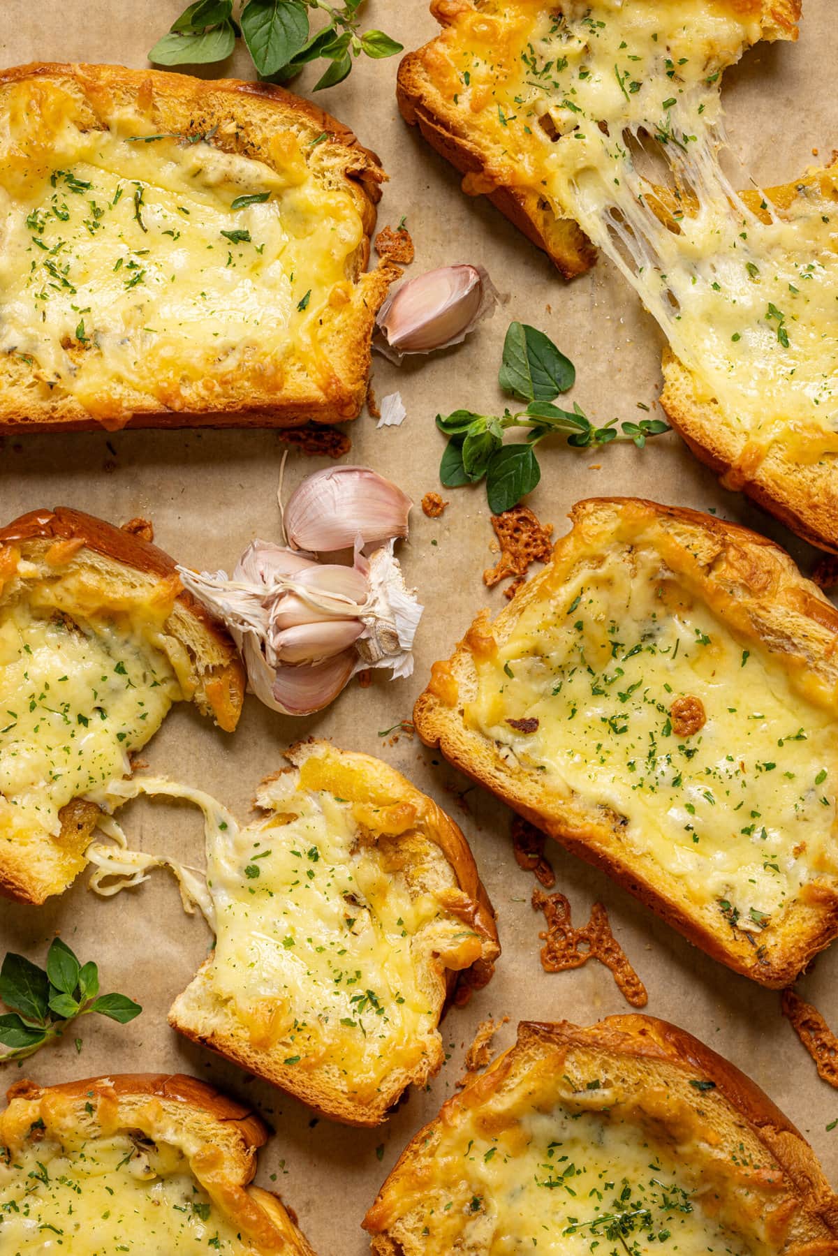 Up close shot of texas toast garlic bread on a baking sheet with parchment paper.