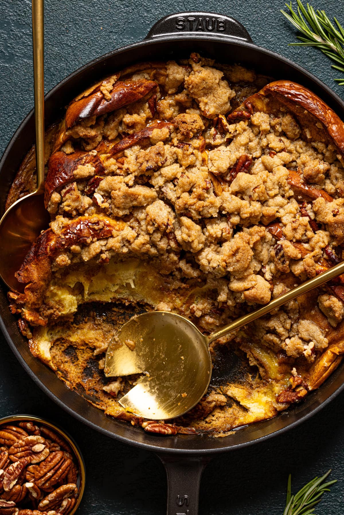 Up close shot of french toast casserole scooped out with two spoons.