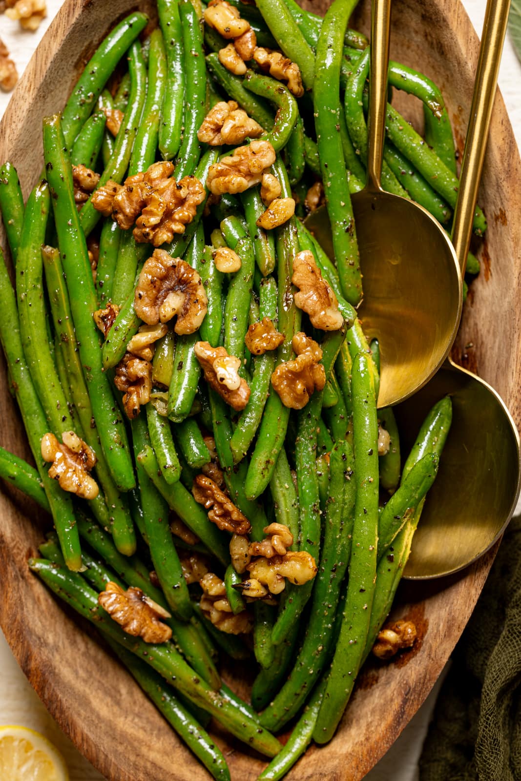 Overhead shot of green beans up close with two spoons.