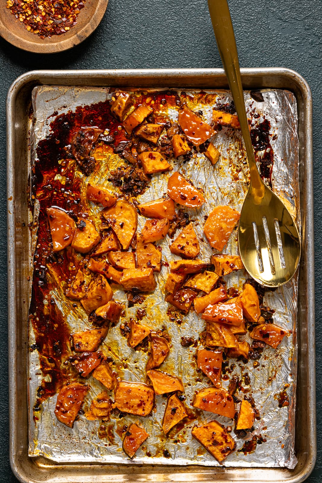 Roasted sweet potatoes on a baking sheet.