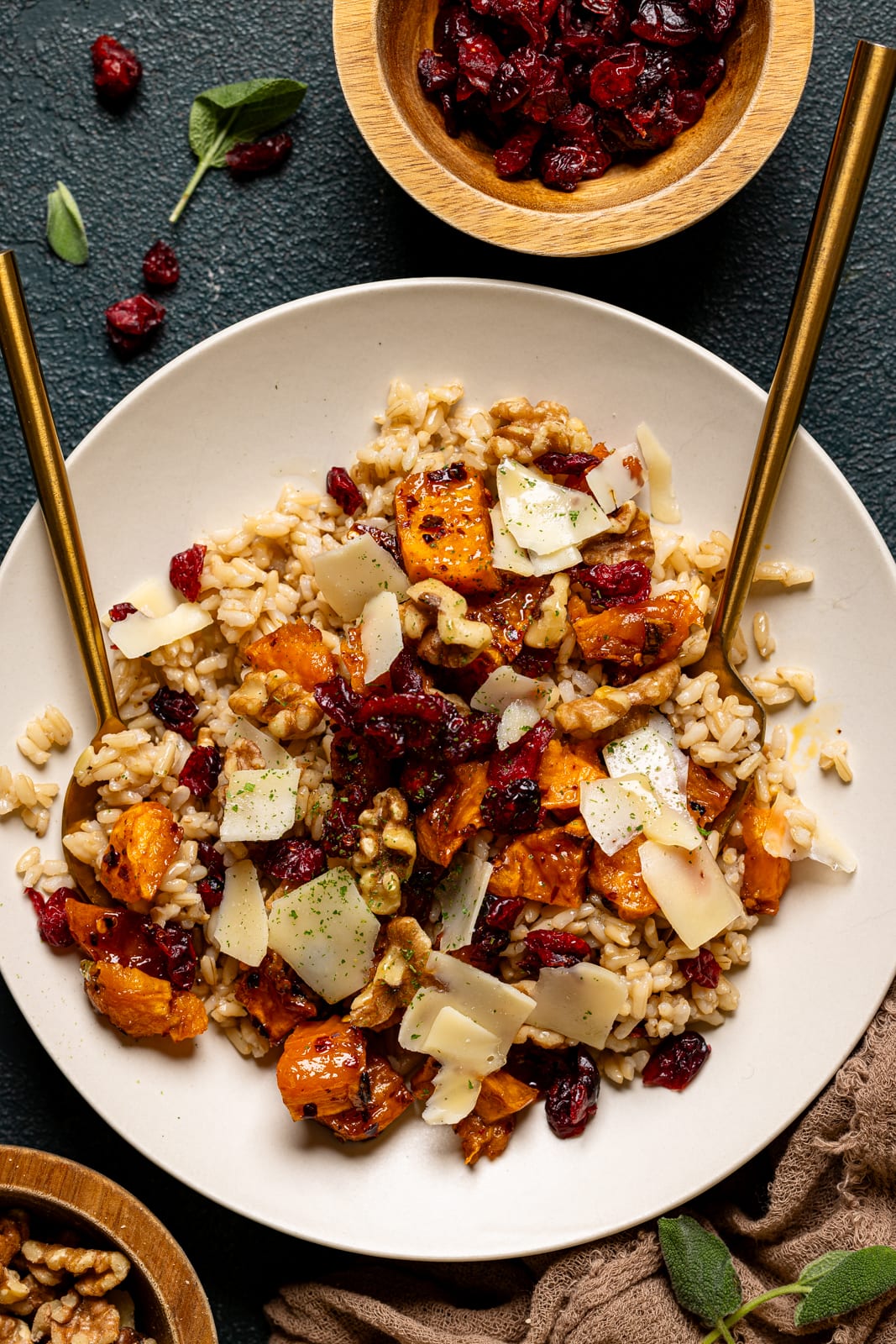 Up close shot of sweet potato bowl with two gold forks.