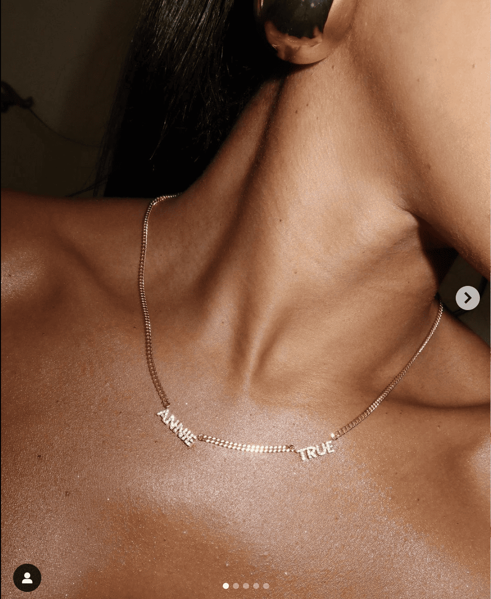 Image of gold necklace on a neck.