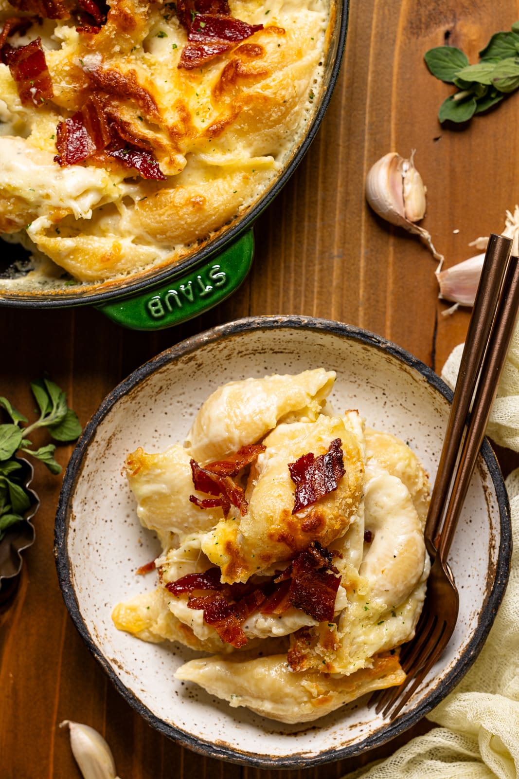 Baked mac and cheese in a bowl with two forks.