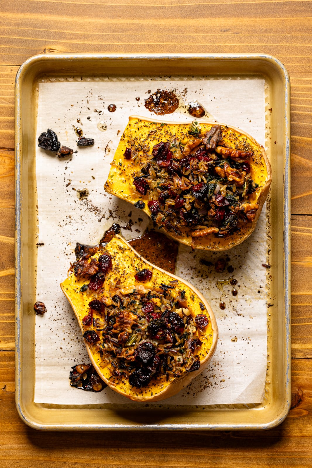 Baked butternut squash on a baking sheet with parchment paper. 