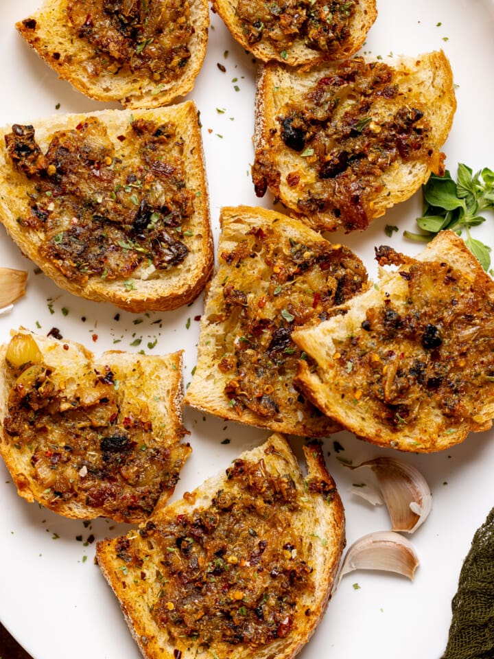 Overview shot of garlic bread in a white platter.