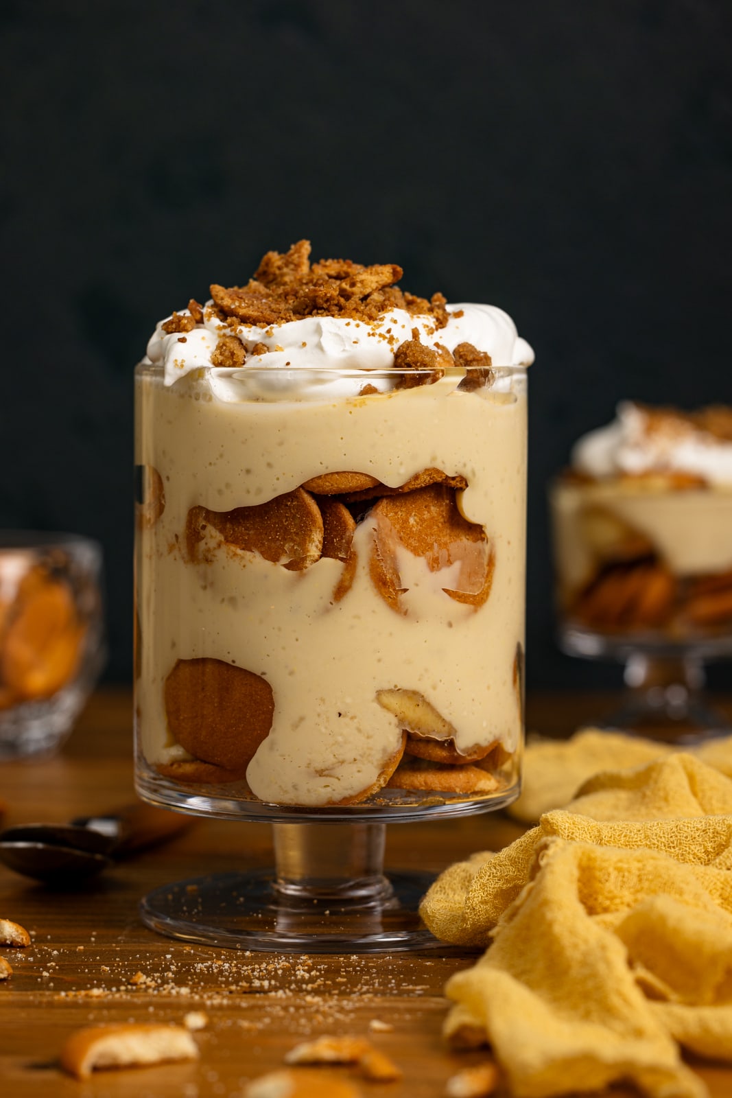 Up close shot of banana pudding in a trifle bowl.