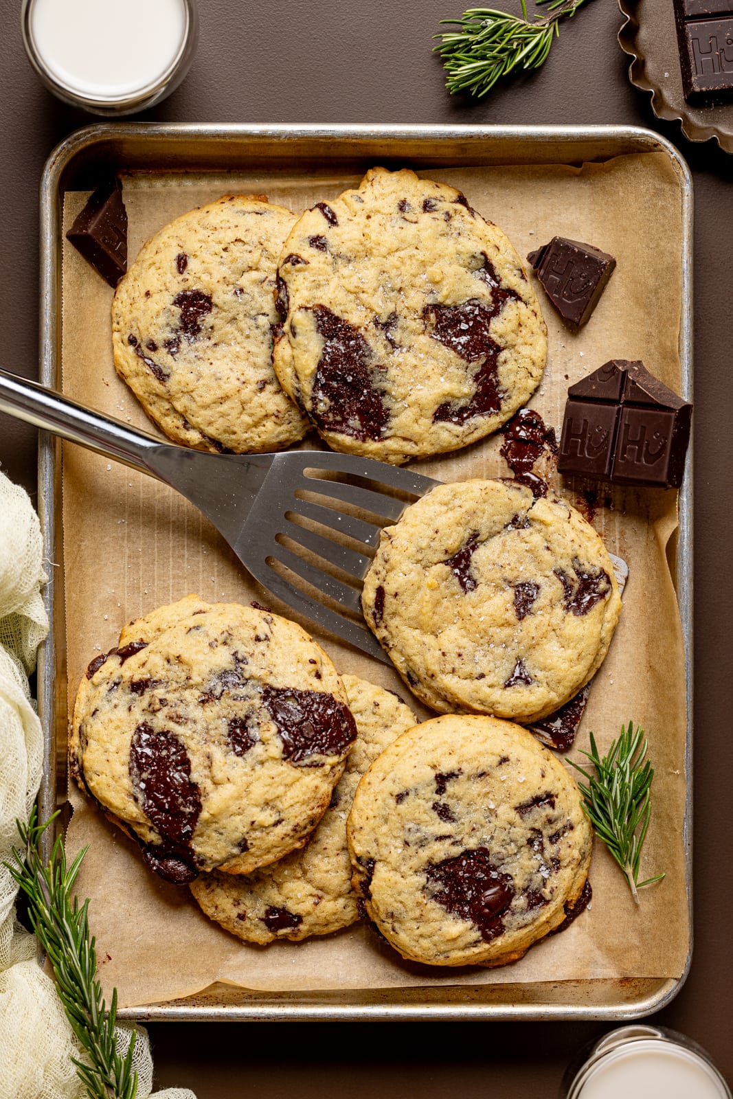 Cookies on a baking sheet with spatula.