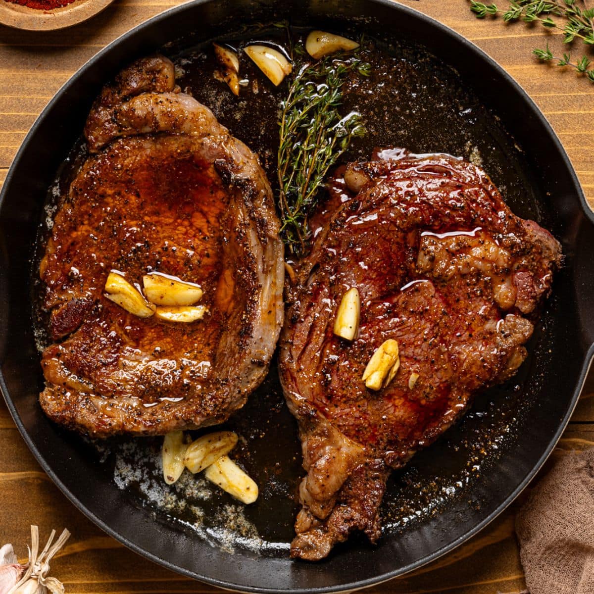 Fully seared steak in a skillet.