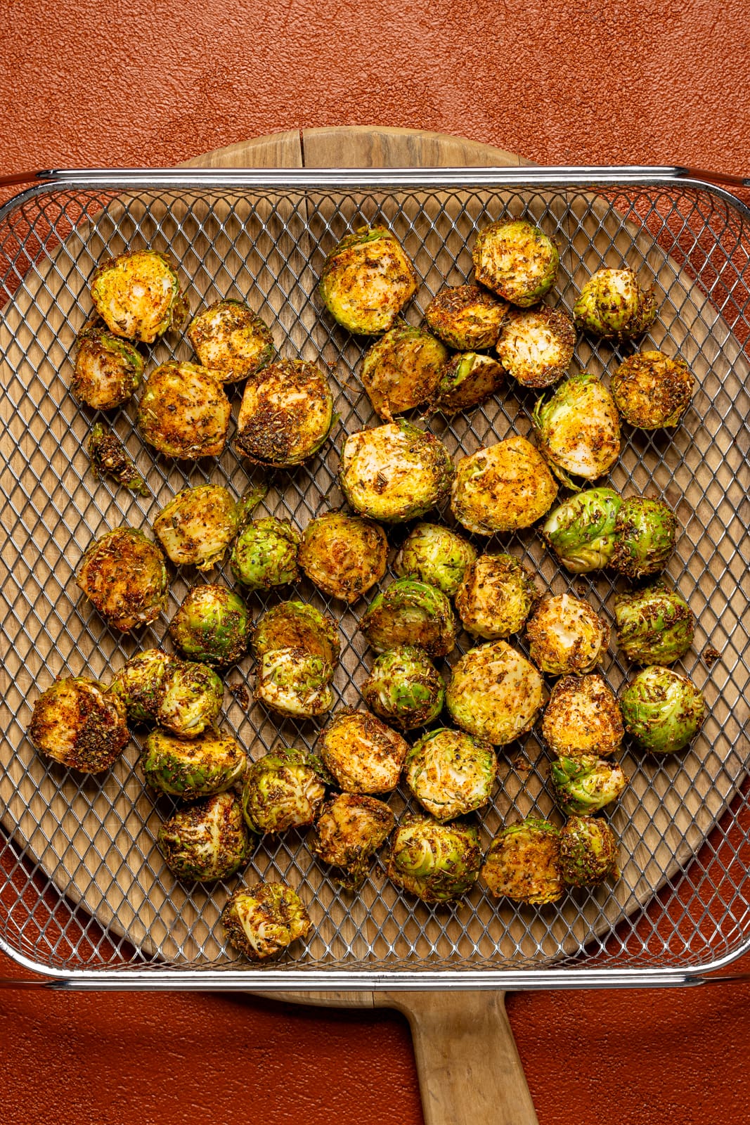 Brussels sprouts in an Air Fryer basket.