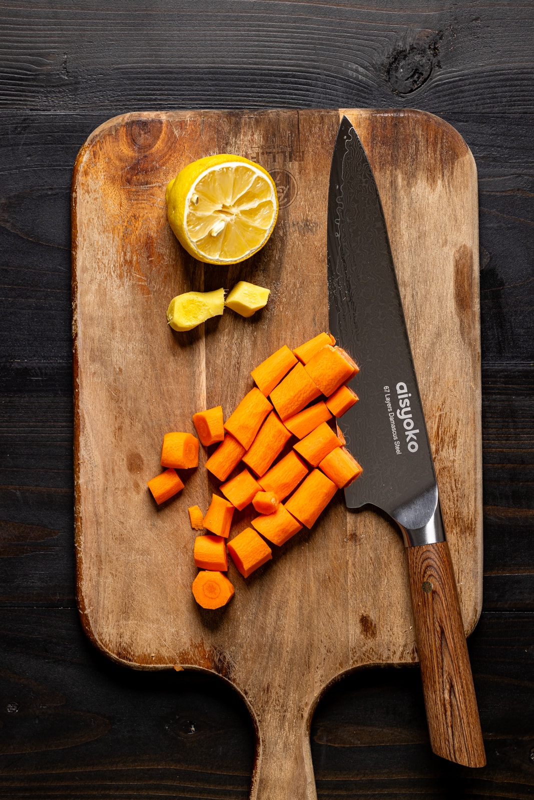 Chopped ingredients on a cutting board with a knife.