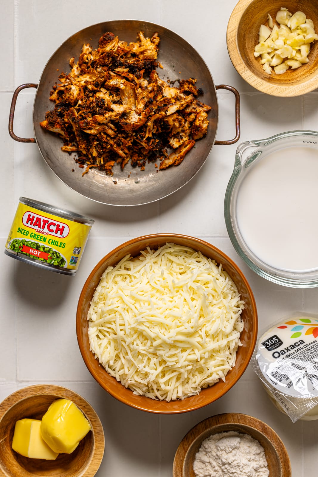 Ingredients on a white tile table.