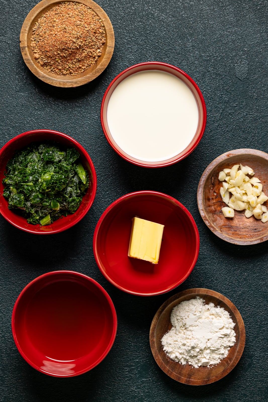 Ingredients on a dark green table.