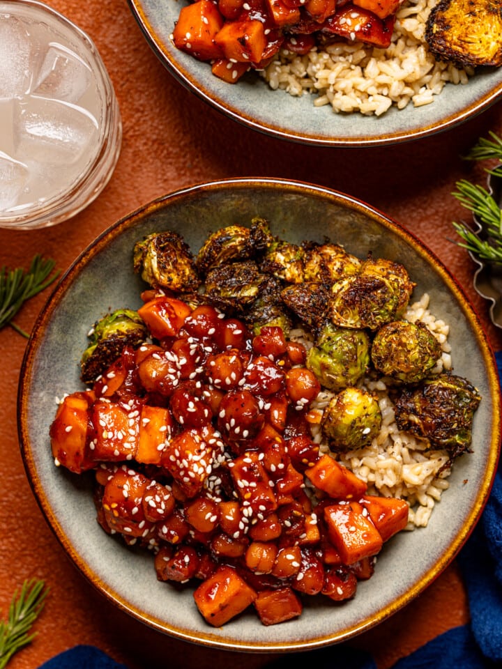 Up close of two bowls of Gochujang dish with a drink.