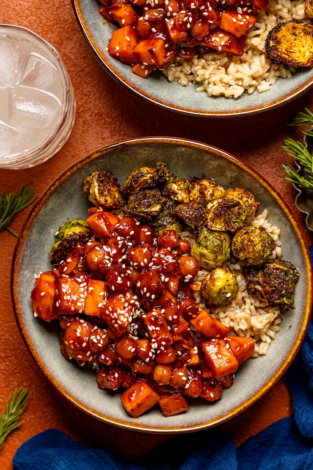 Up close of two bowls of Gochujang dish with a drink.