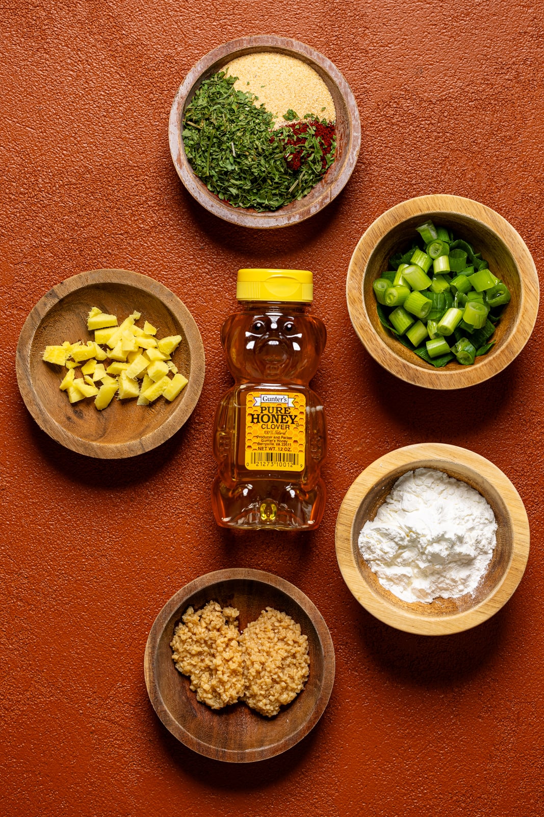 Ingredients on a burnt orange table.