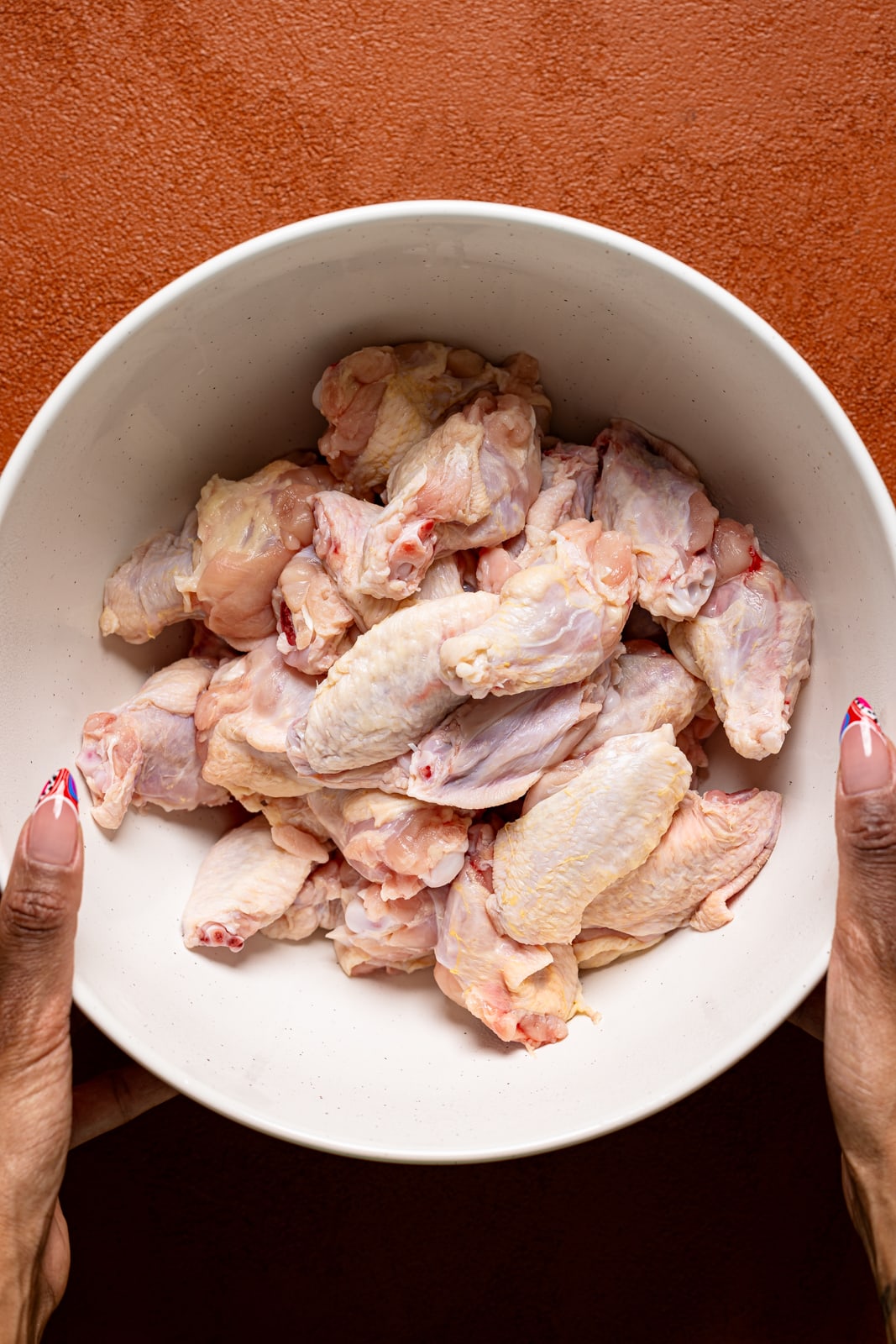 Freshly clean chicken wings in a bowl.