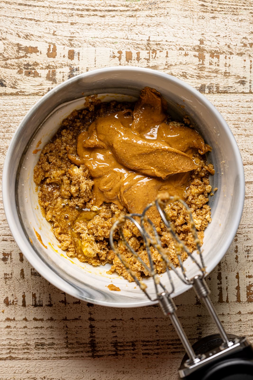 Ingredients together in a mixing bowl with a mixer.