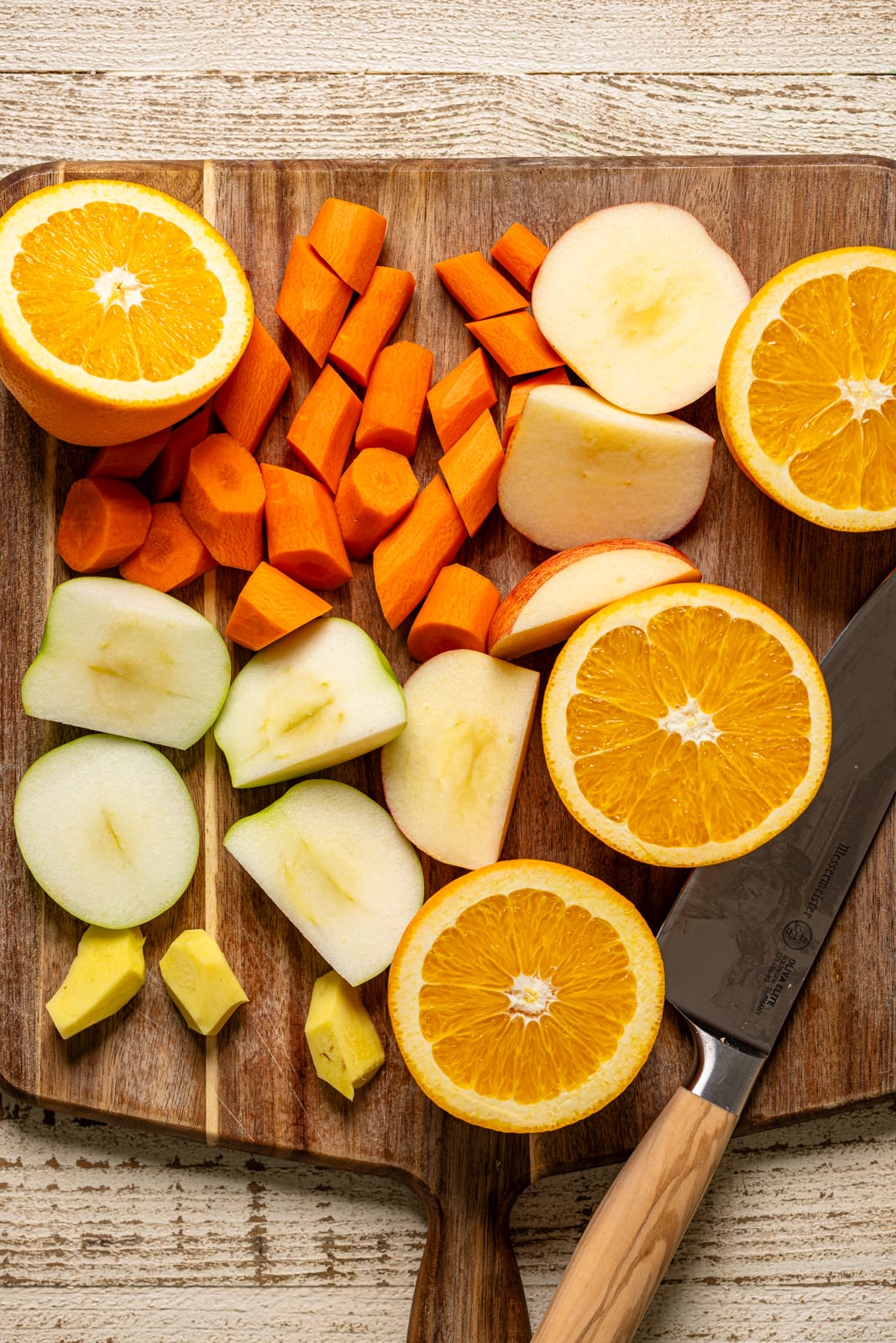 All ingredients chopped on a cutting board with a knife.