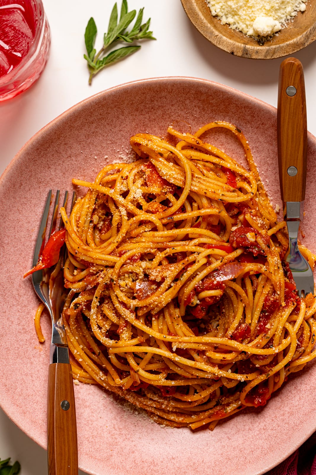 Up close shot of spaghetti in a pink plate.