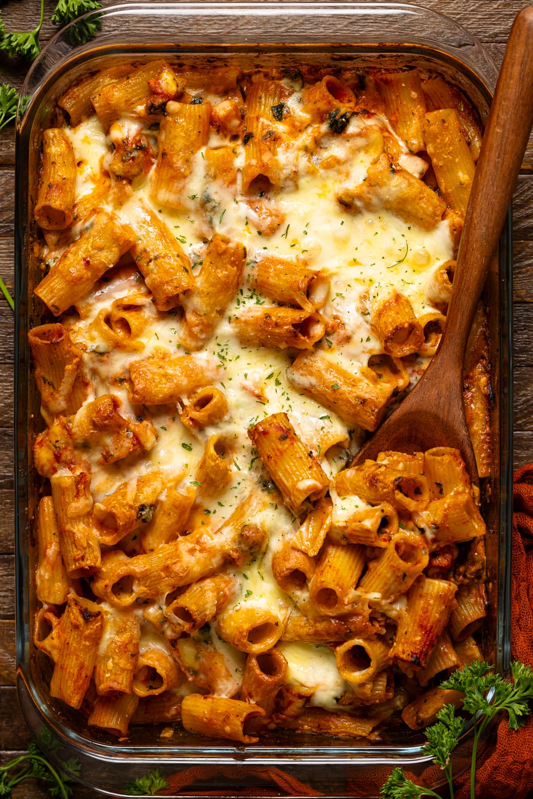 Baked pasta with a wooden spoon.