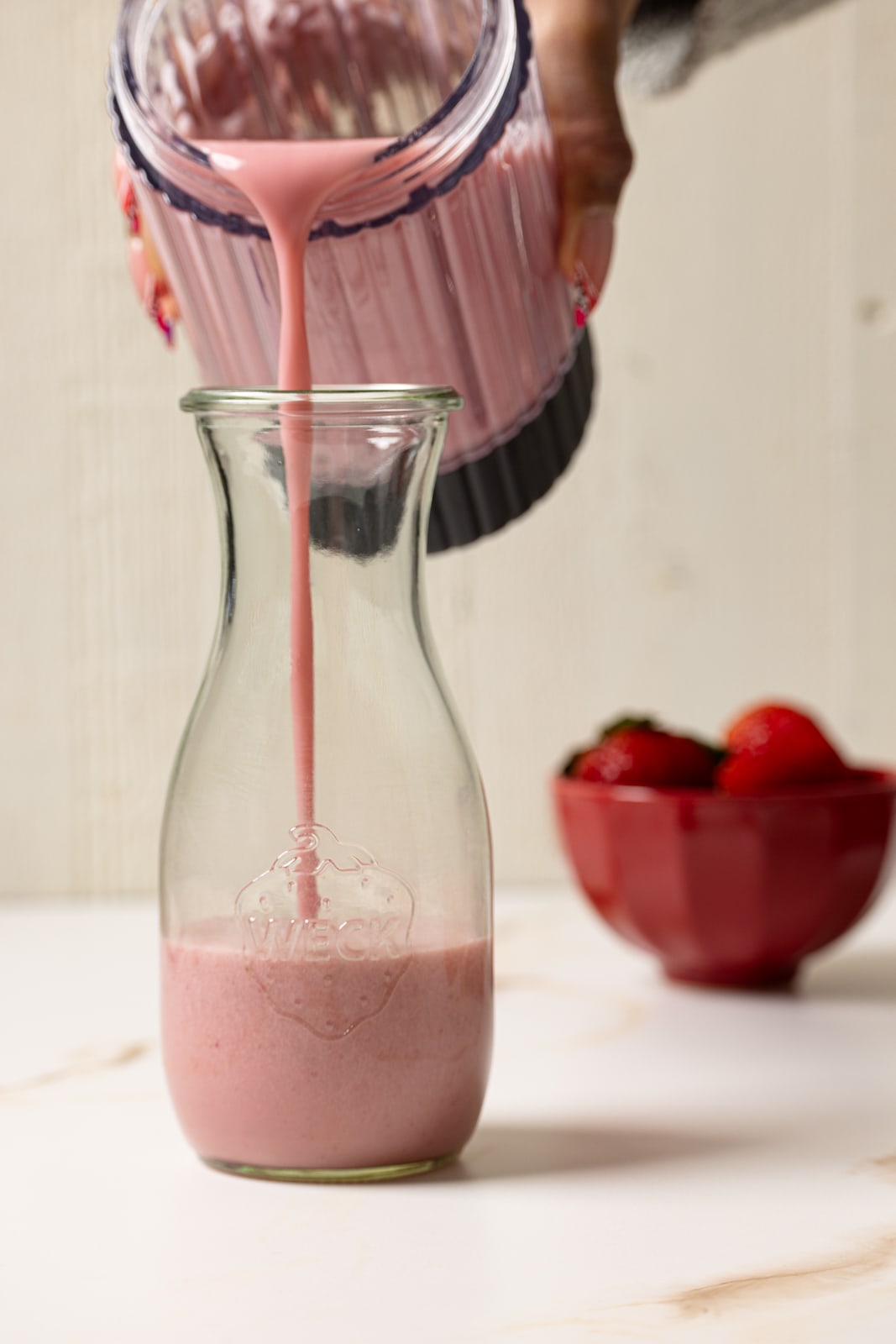 Pouring of milk in a jar.