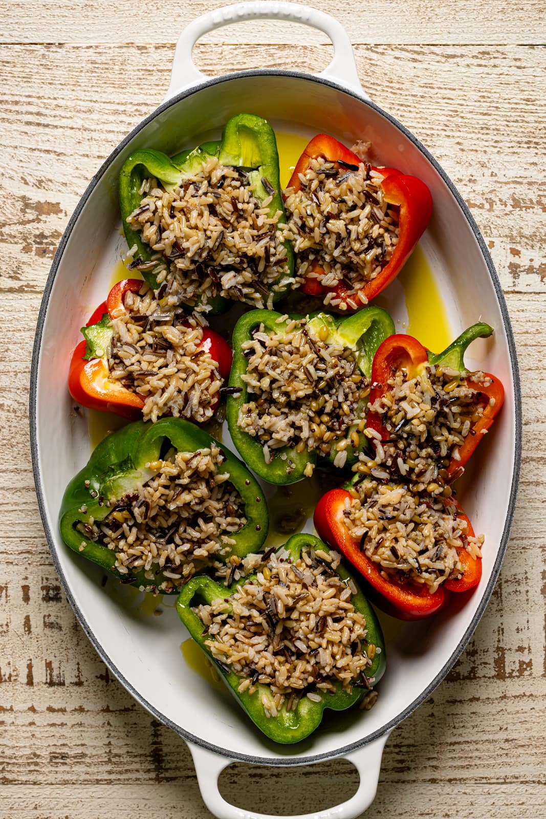 Stuffed peppers prepped in a baking dish.