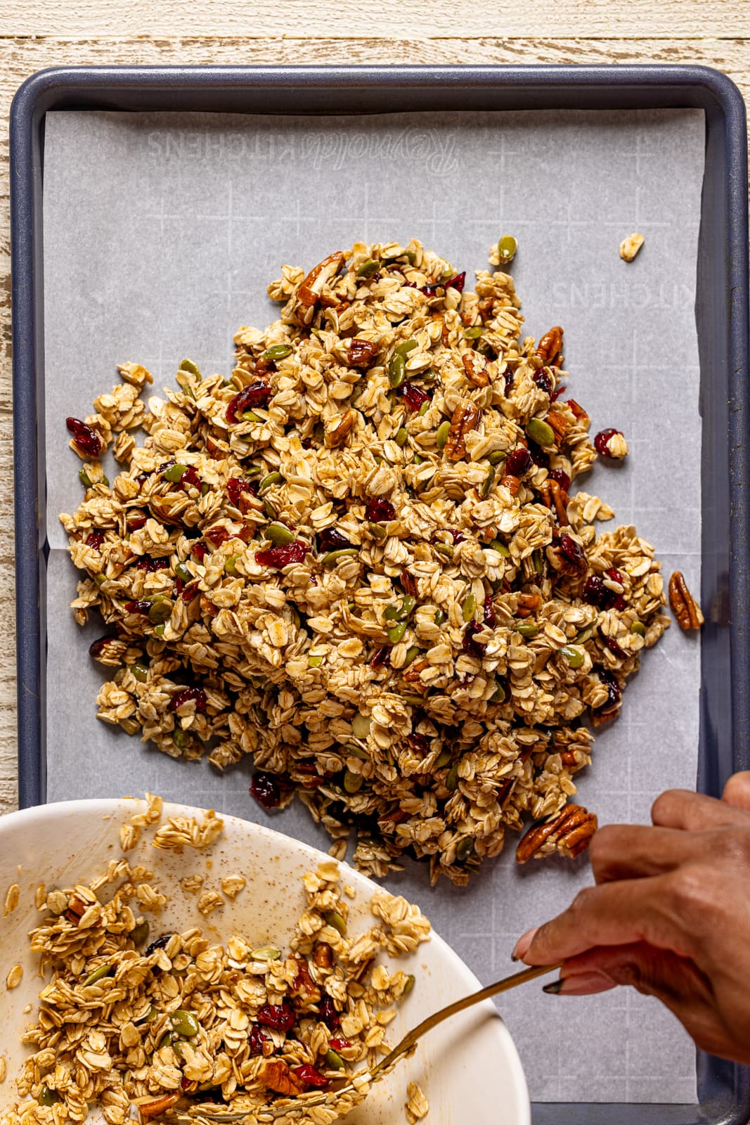 Ingredients scooped onto a baking sheet with parchment paper.