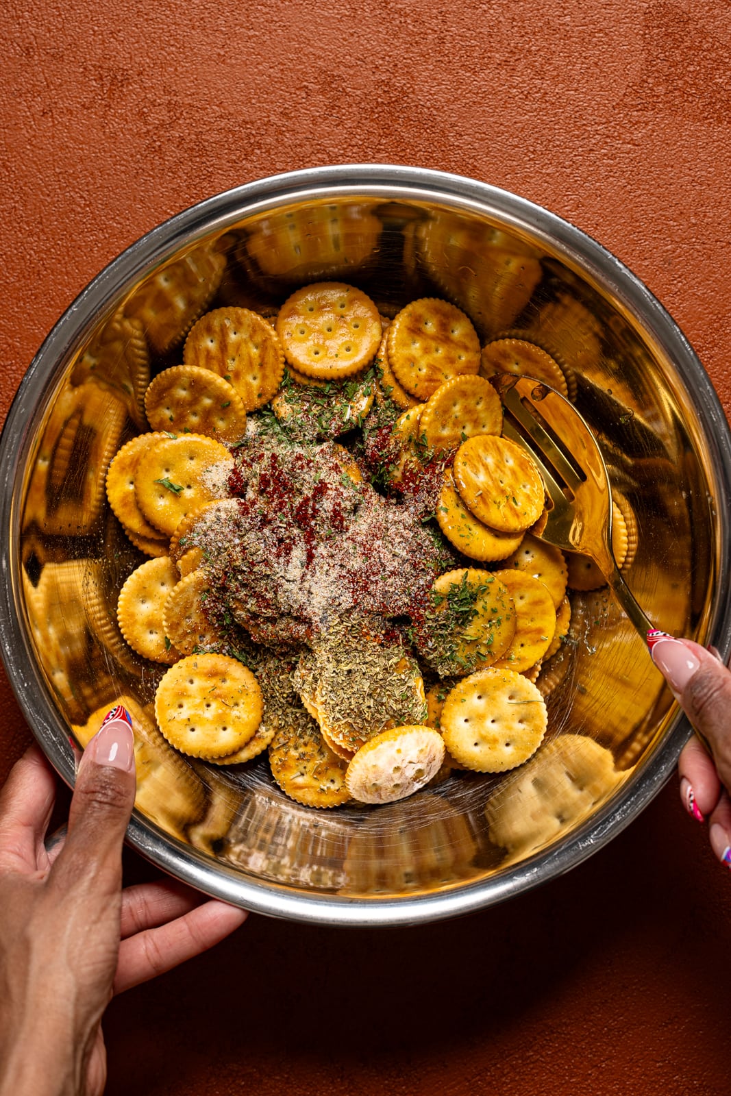 Crackers and ingredients in a silver bowl.