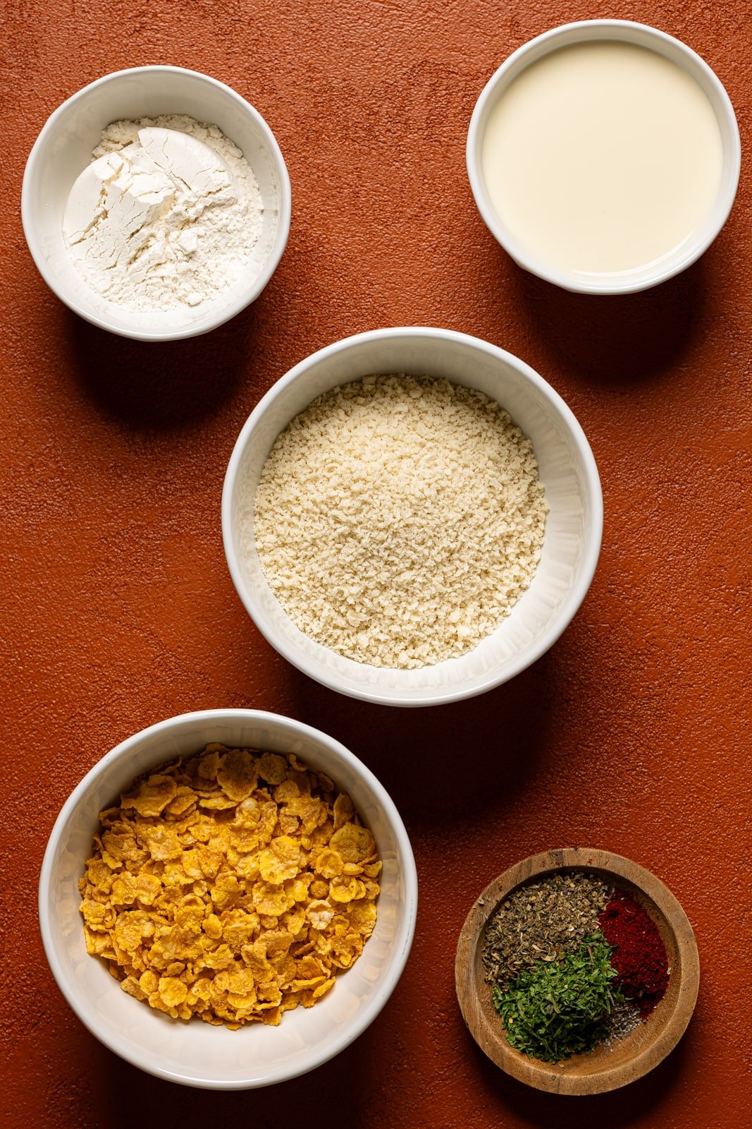 Ingredients on a burnt orange table.