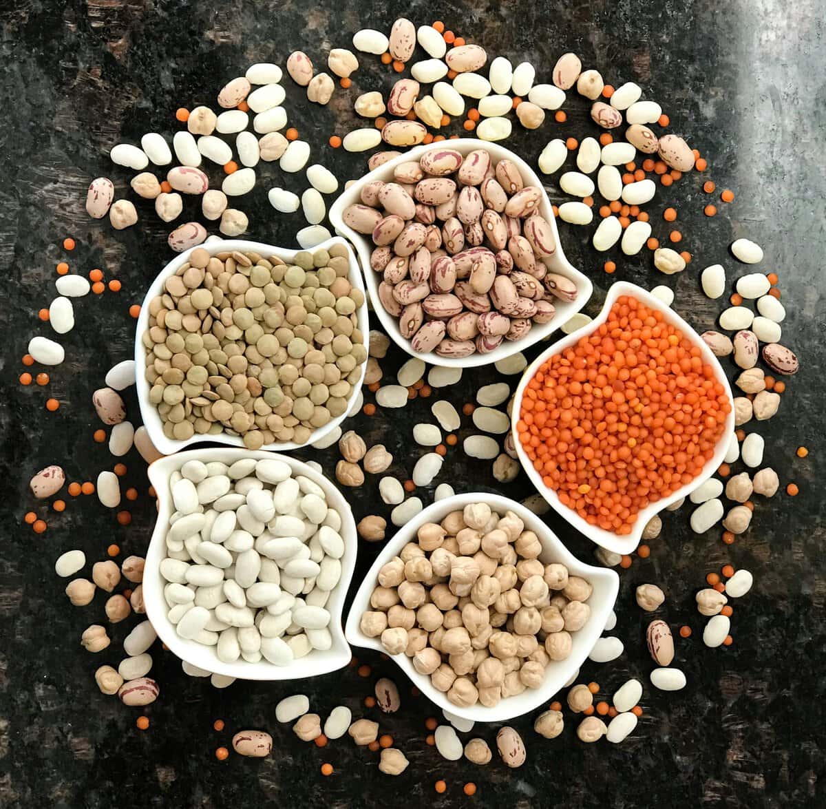 High protein legumes in white bowls.
