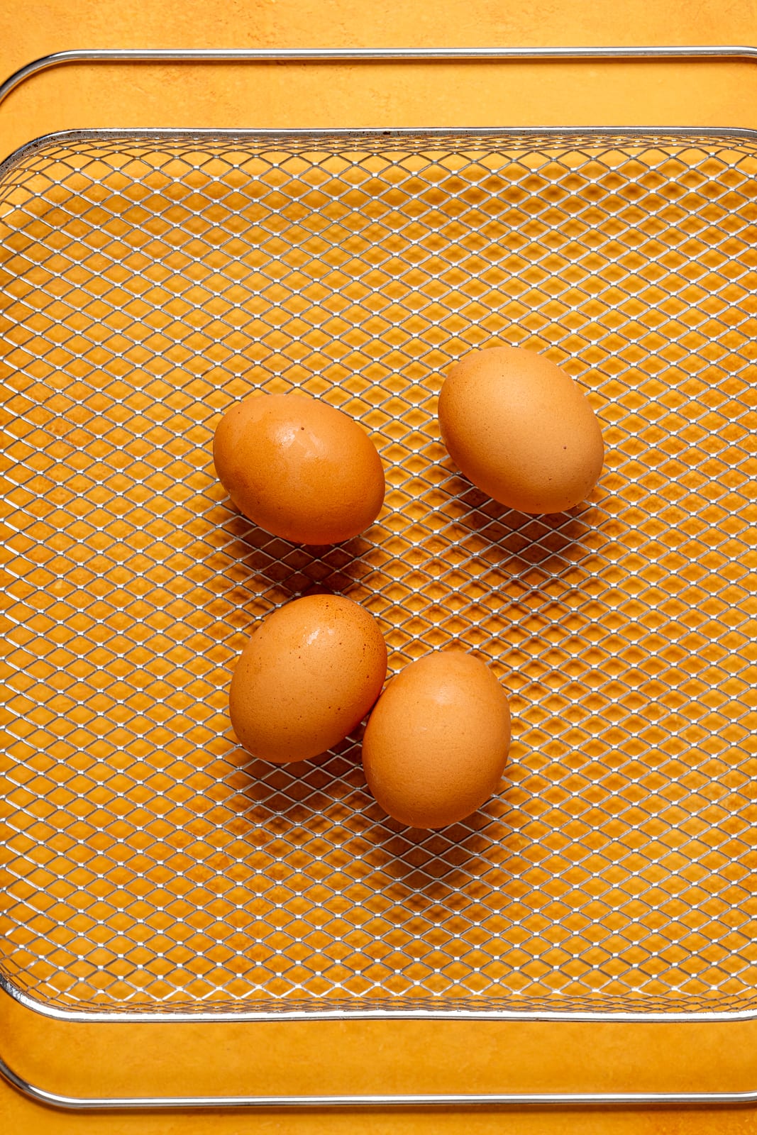 Eggs on a Air Fryer basket.