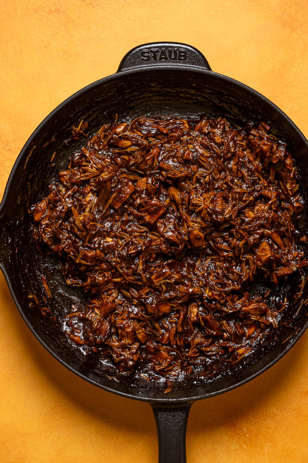 Cooked BBQ Jerk jackfruit shredded in a skillet.