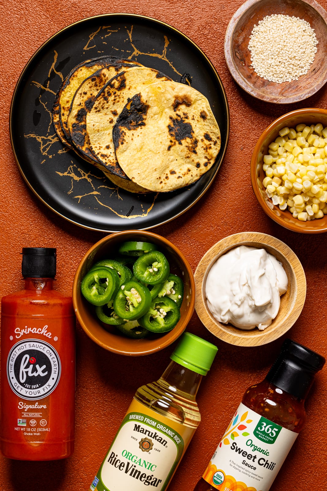 Ingredients on a burnt orange table.