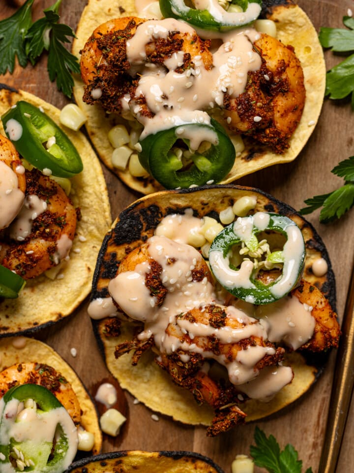 Up close shot of shrimp tacos with a spoon.