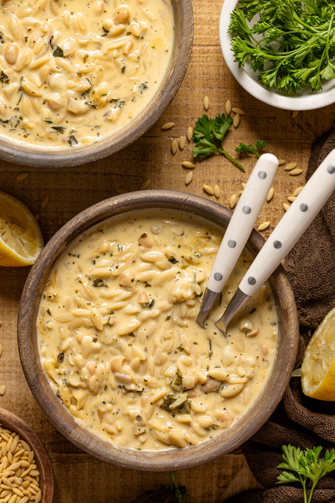 Up close shot of soup with two spoons.