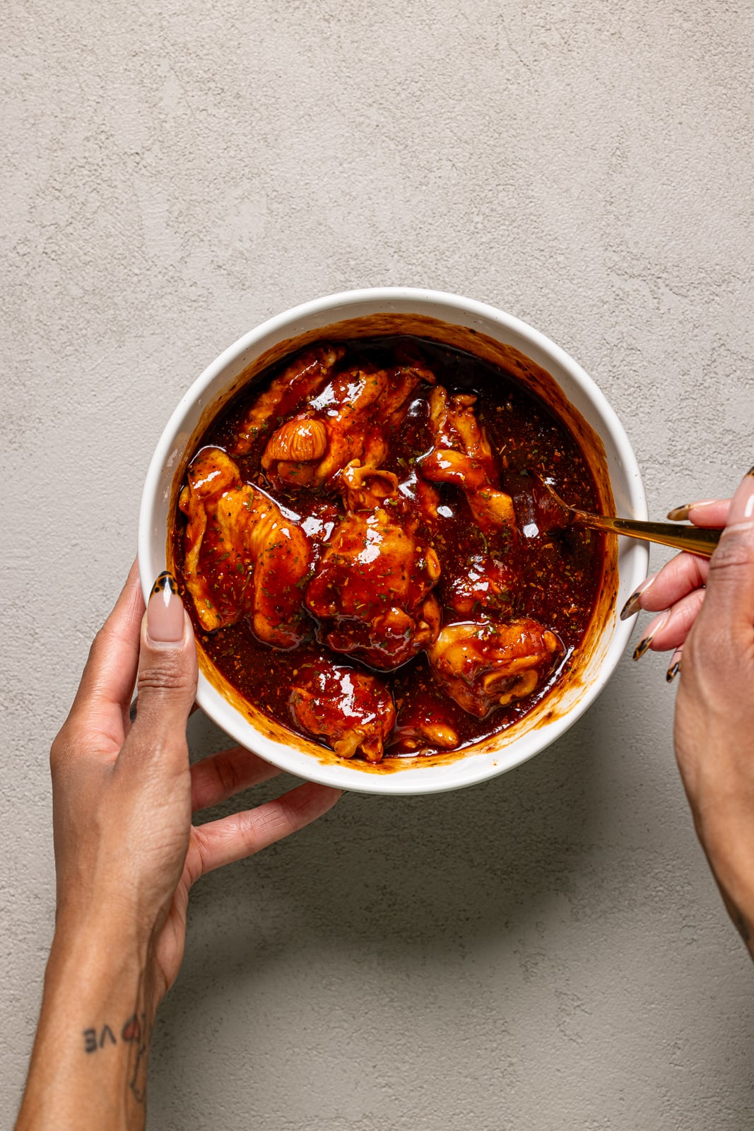 All ingredients being mixed together in a white bowl.