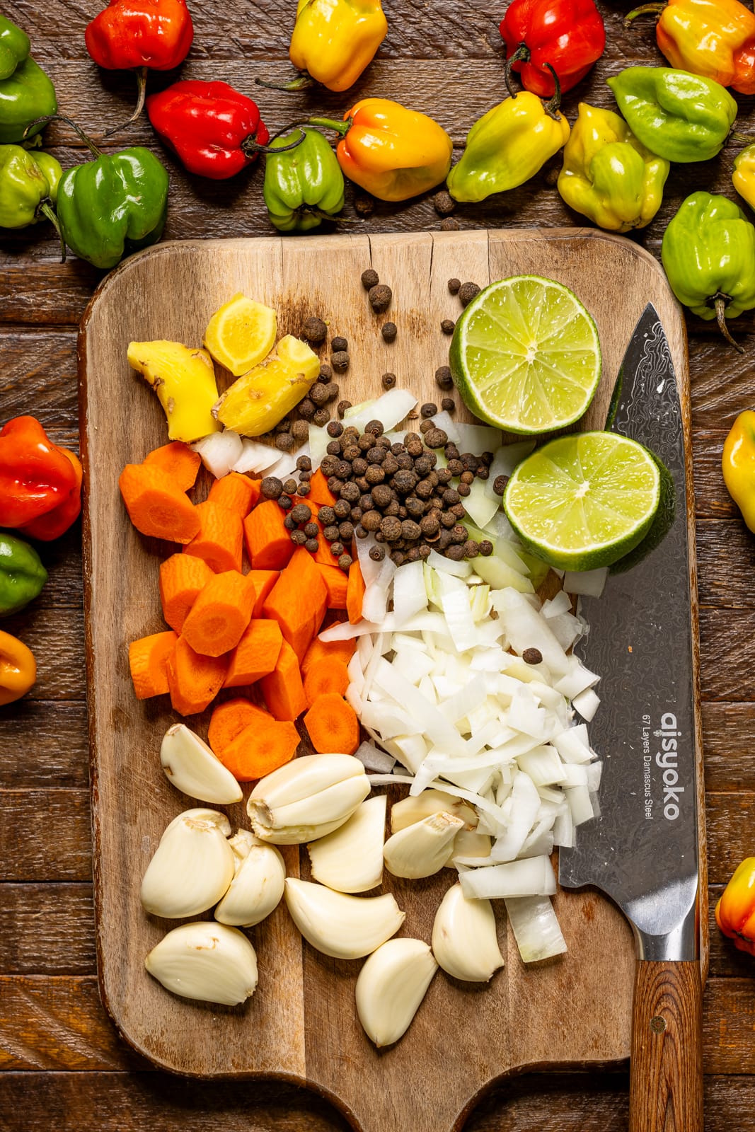 Ingredients being chopped on a cutting board with a knife.