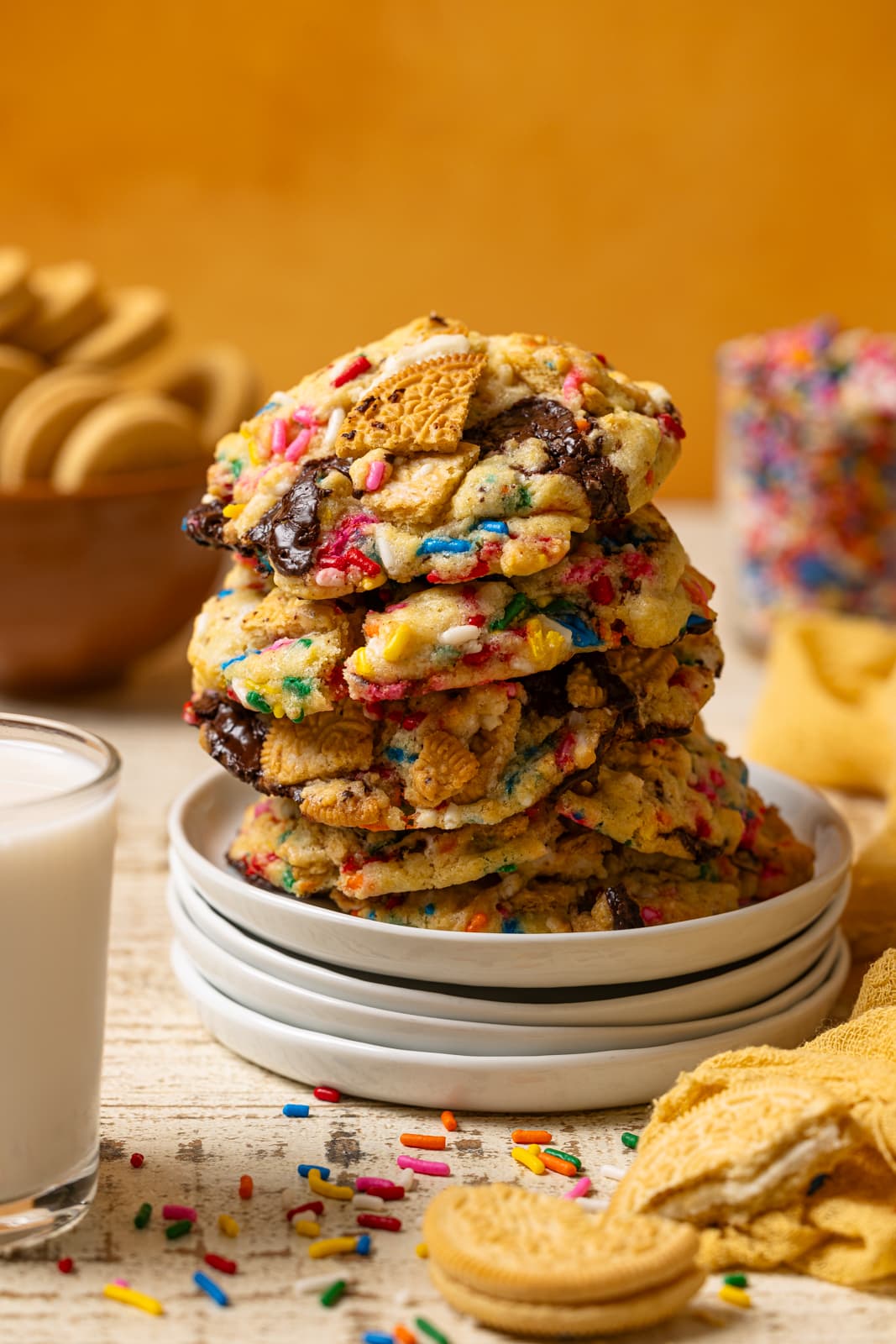 Up close shot of stacked cookies on a white plates.