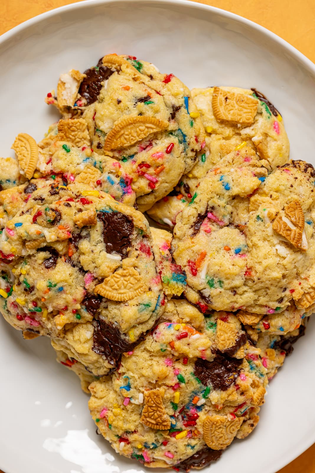 Up close shot of baked cookies in a white plate.