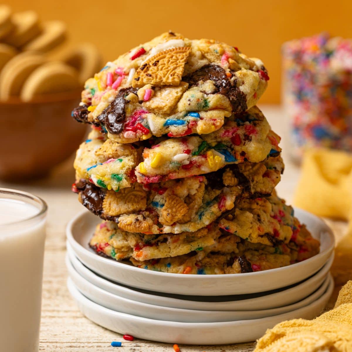 Up close shot of stacked cookies on a white plates.