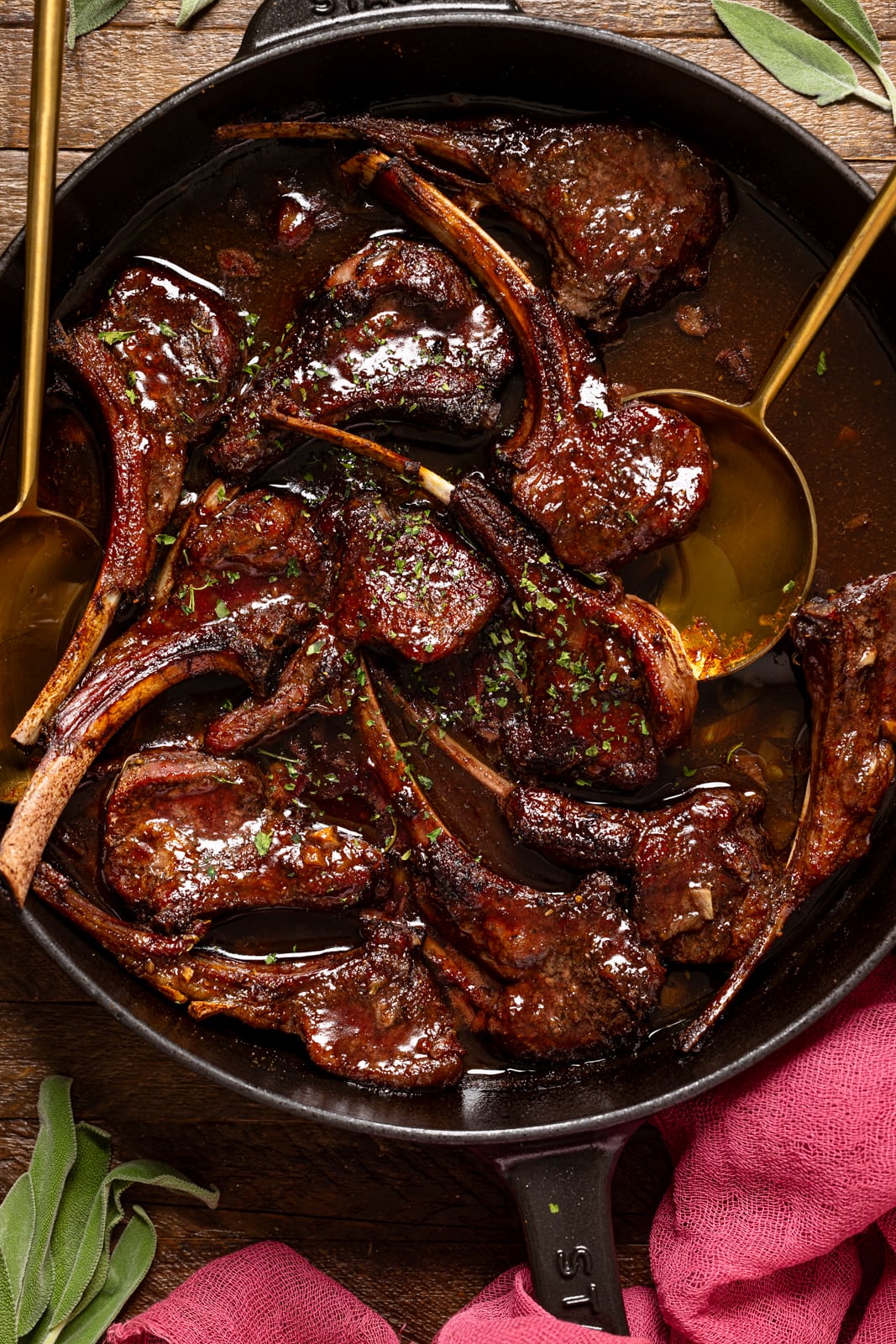 Up close shots of lamb chops in a skillet.