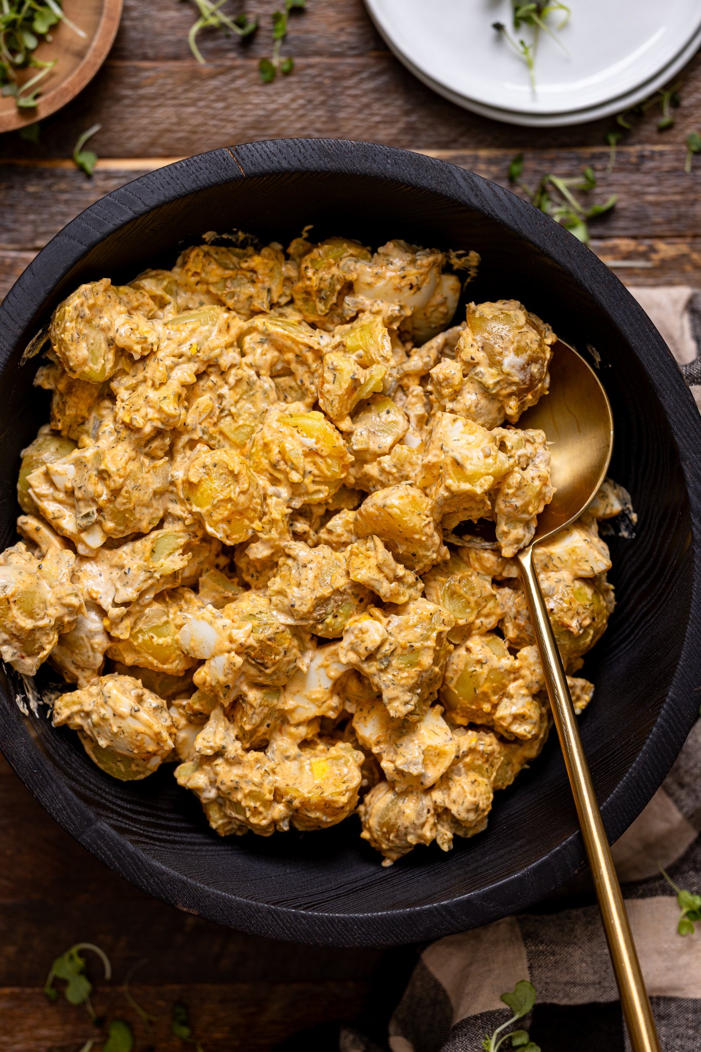 Up close shot of My Fave Southern Potato Salad Recipe in a bowl with a spoon.