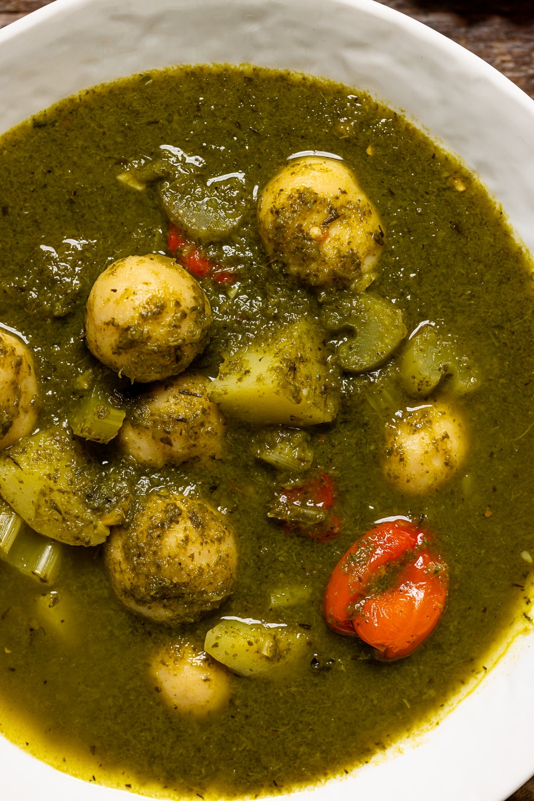 Up close shot of soup in a white bowl.