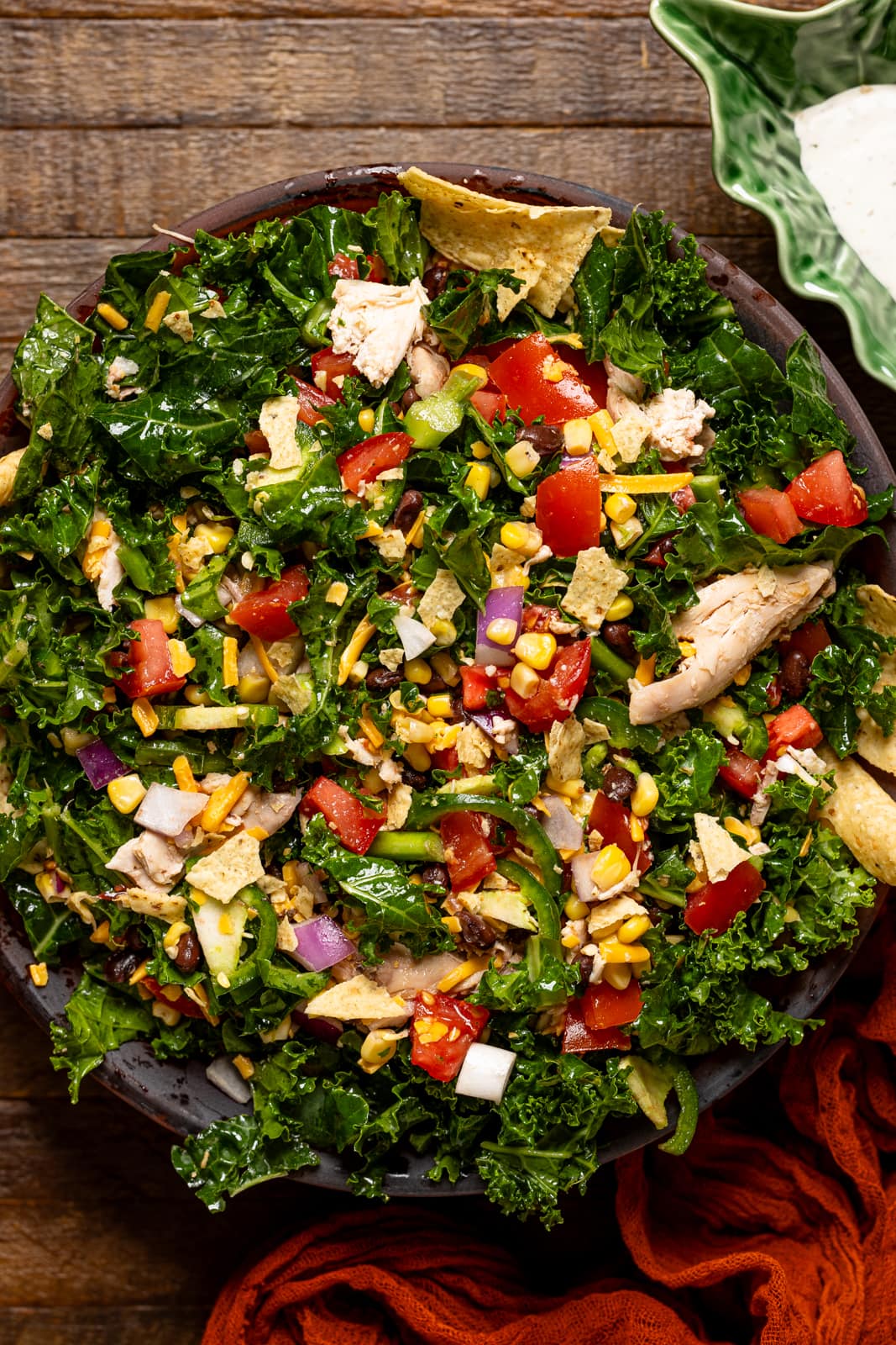 A bowl with the salad and tortilla chips.