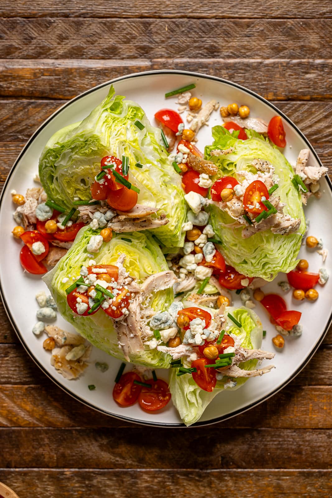 Overhead shot of wedge salad on a white serving platter.